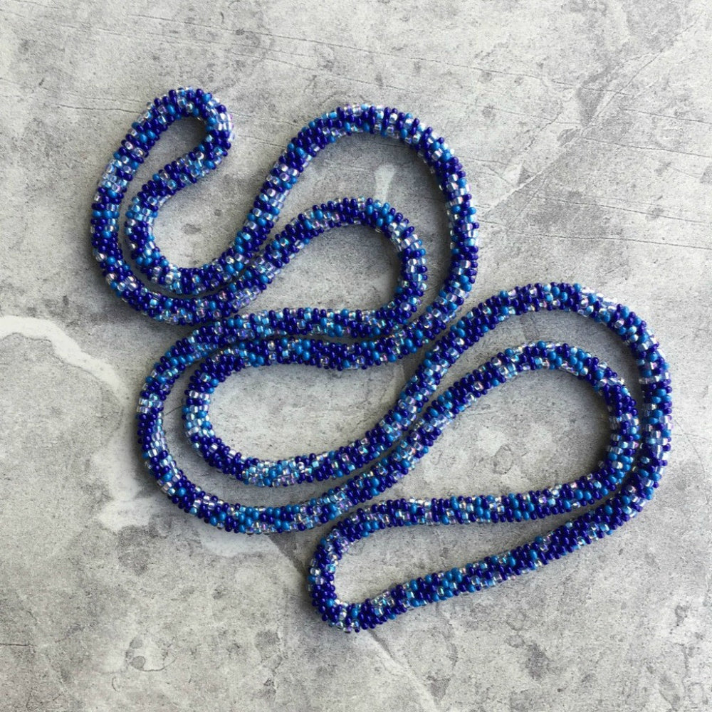 long beaded crochet rope necklace in blue