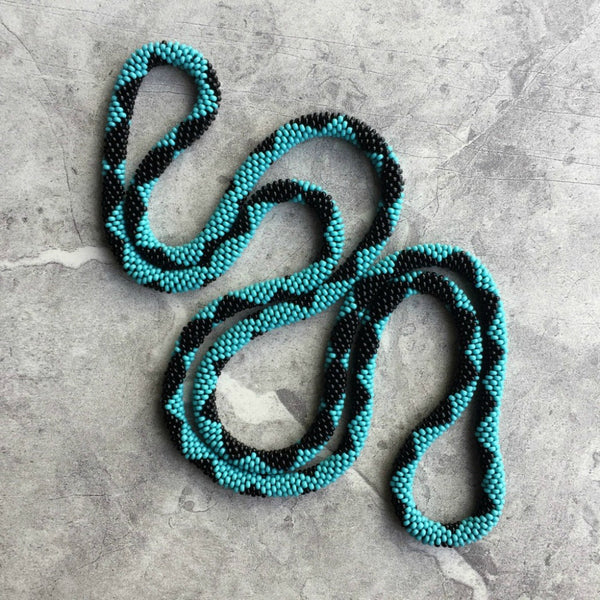 long continuous beaded crochet rope necklace in turquoise and black