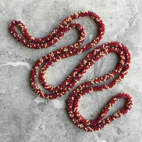 long continuous beaded crochet rope necklace in red and cream