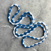 long continuous beaded crochet rope necklace in blue and white