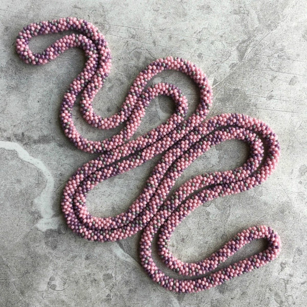 long continuous beaded crochet rope necklace in pink, purple and grey