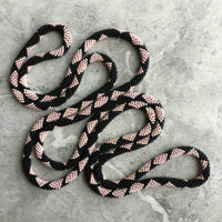 long continuous beaded crochet rope necklace in pink and black