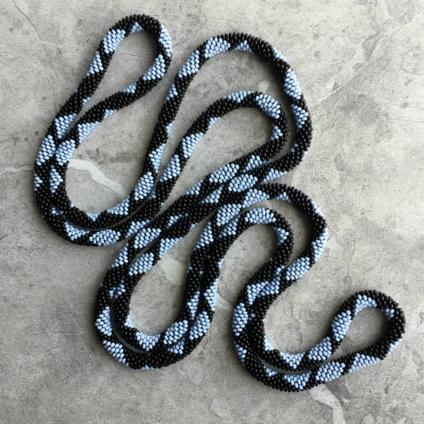 long continuous beaded crochet rope necklace in blue and black