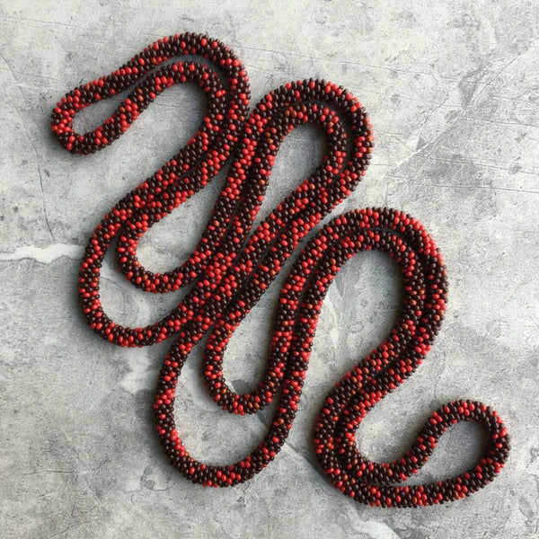 long continuous beaded crochet rope necklace in red and brown
