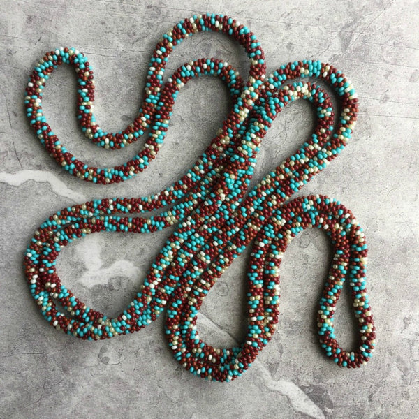 long continuous beaded crochet rope necklace in turquoise, brown and cream