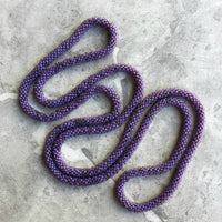 long continuous beaded crochet rope necklace in purple
