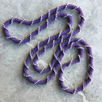 long continuous beaded crochet rope necklace in purple and white