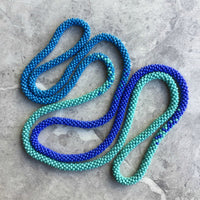 long continuous beaded crochet rope necklace in turquoise, violet and blue