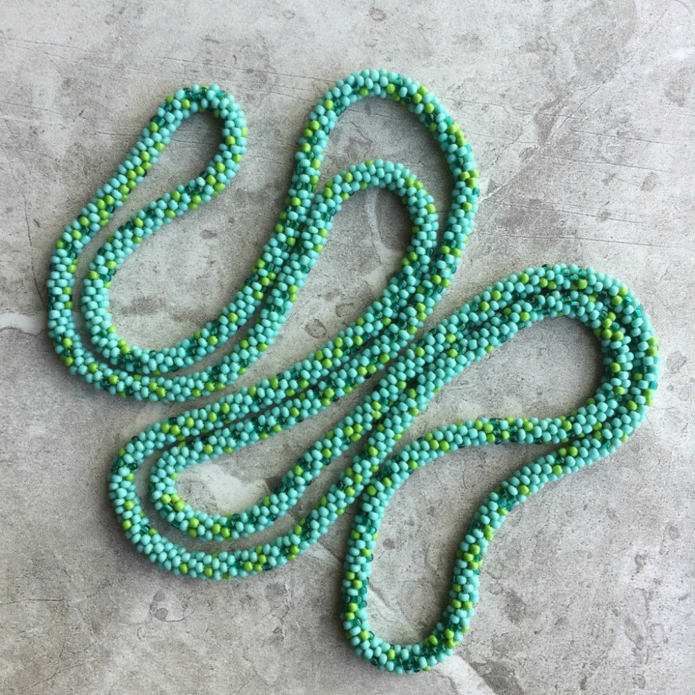 long continuous beaded crochet rope necklace in turquoise and green