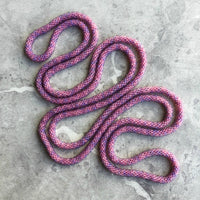 long continuous beaded crochet rope necklace in pink and purple
