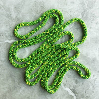 long continuous beaded crochet rope necklace in greens and yellow
